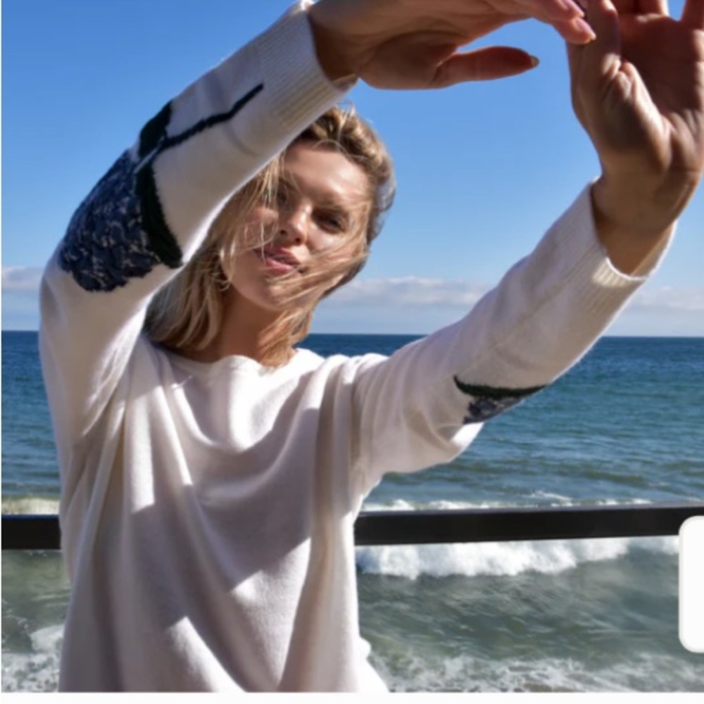 Chic White Sweater with Blue Accents